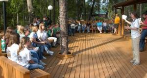 instructor giving presentation to a group of seated students