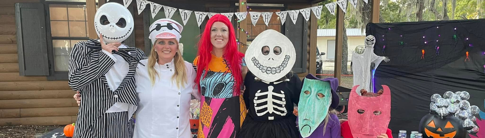 Banner image of participants at Timpoochees Trick or Treat event