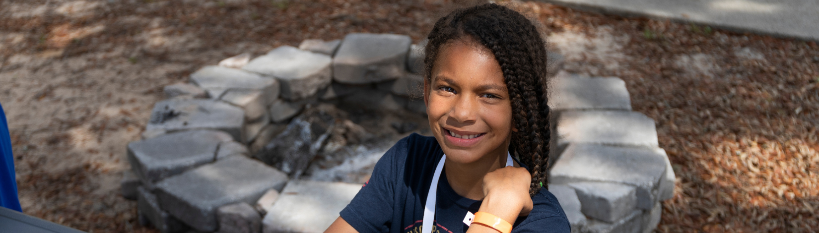 Photo of youth smiling at camp timpoochee