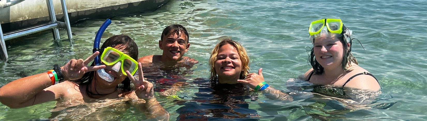 Banner image of youth snorkling