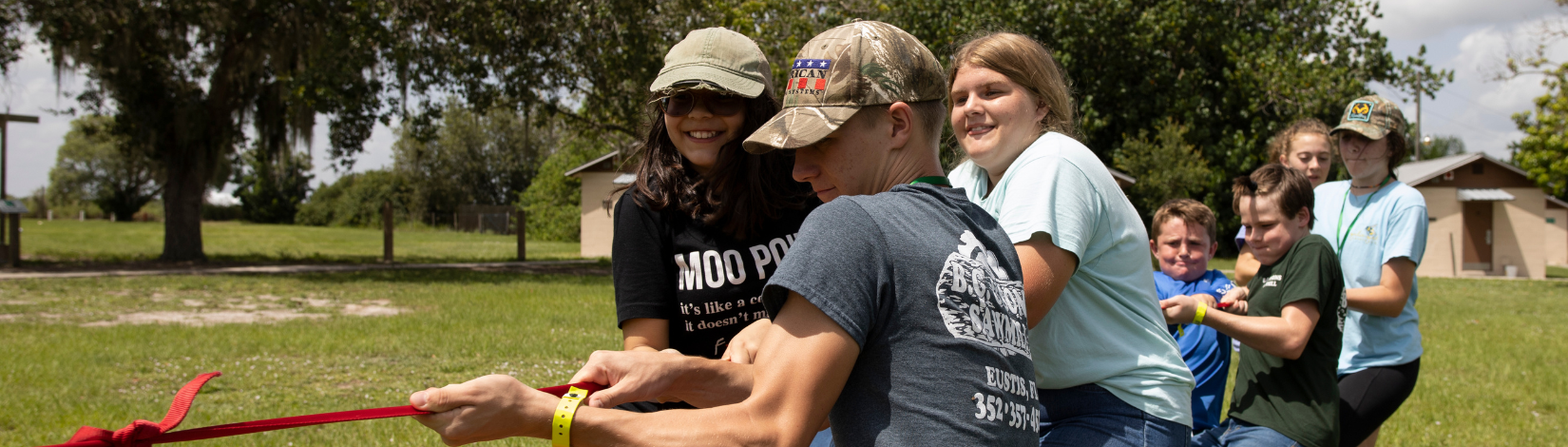 Banner image of youth playing tug-of-war