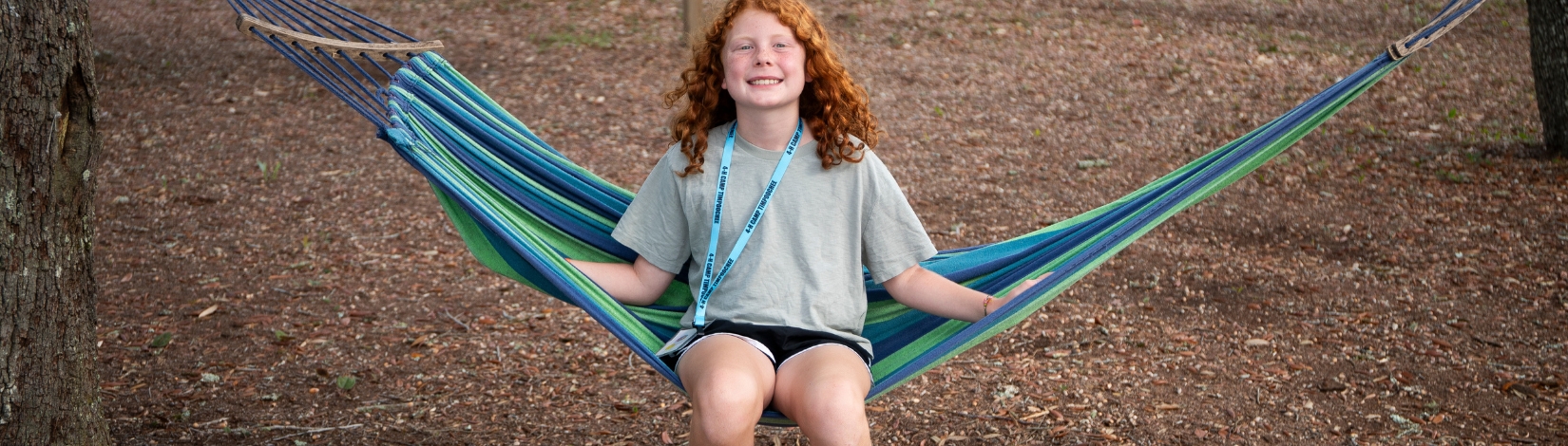 Photo of youth at Camp Timpoochee on a hammock